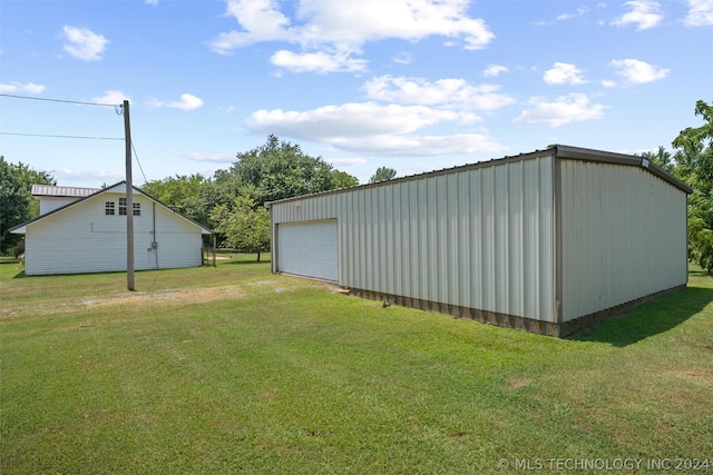 view of outdoor structure with a lawn