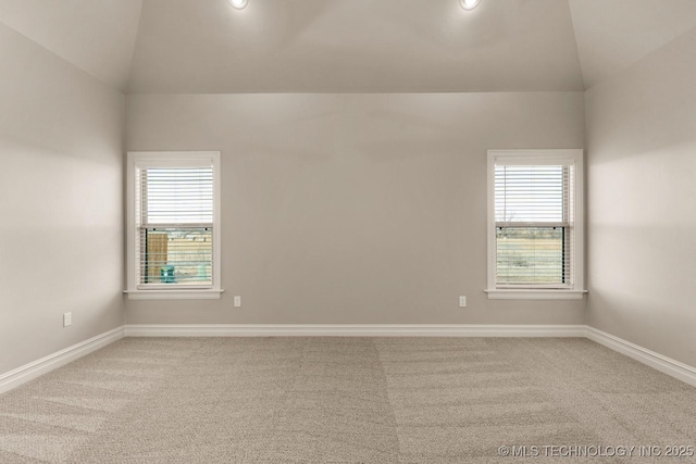 carpeted spare room with lofted ceiling, baseboards, and recessed lighting