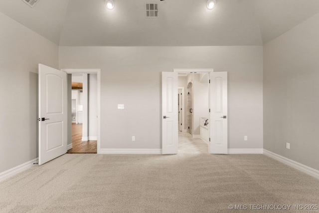 unfurnished bedroom with light colored carpet, visible vents, and baseboards