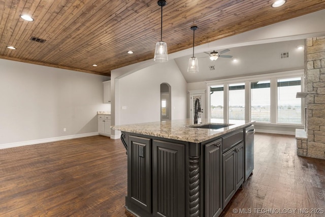 kitchen with visible vents, arched walkways, a sink, vaulted ceiling, and stainless steel dishwasher