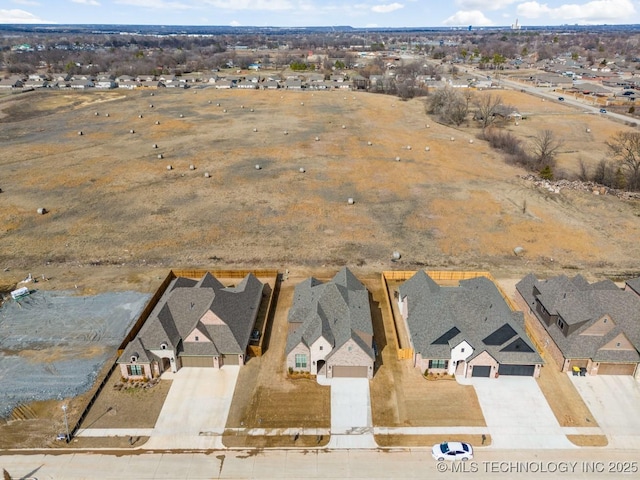 birds eye view of property with a residential view