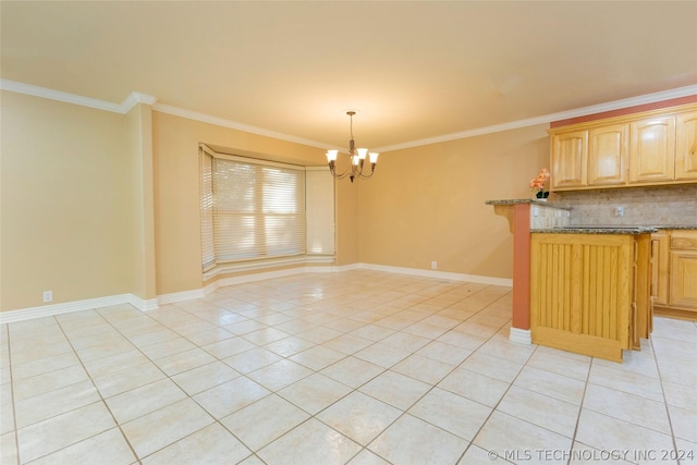 kitchen featuring light tile patterned floors, crown molding, hanging light fixtures, and a chandelier