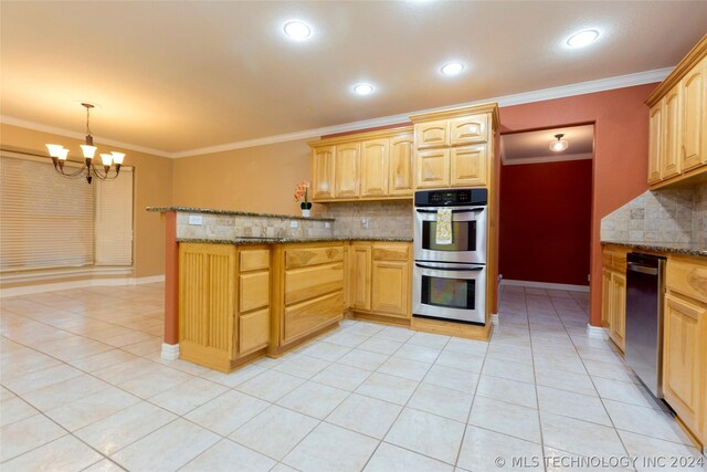 kitchen with a chandelier, pendant lighting, stainless steel double oven, and crown molding