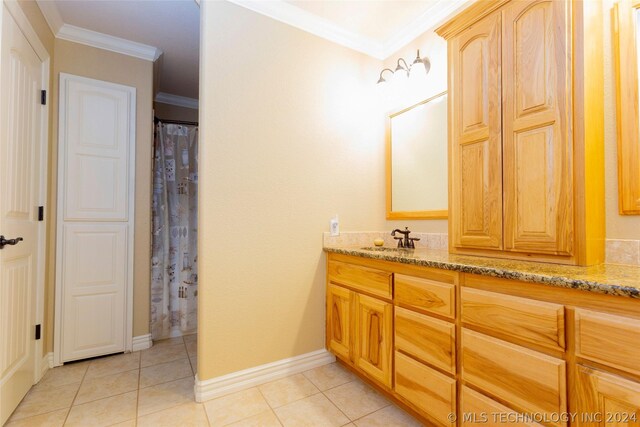 bathroom with tile patterned flooring, vanity, a shower with curtain, and crown molding