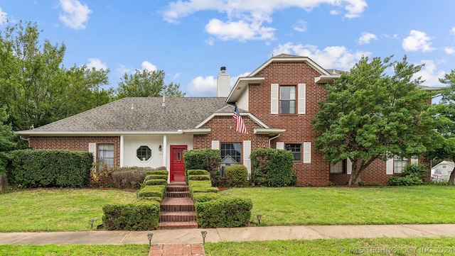 view of property with a front lawn