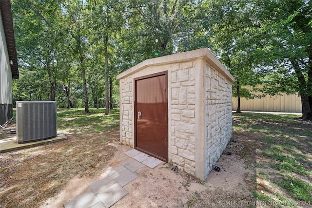 view of outbuilding featuring central AC unit