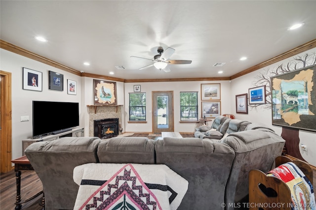 living room featuring crown molding, ceiling fan, and wood-type flooring