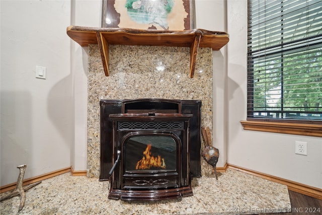 details featuring a fireplace and hardwood / wood-style floors