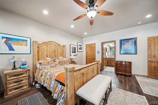 bedroom featuring dark hardwood / wood-style flooring, connected bathroom, and ceiling fan