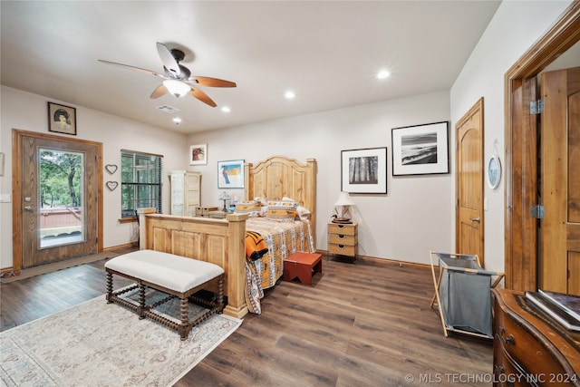 bedroom featuring ceiling fan and dark hardwood / wood-style flooring