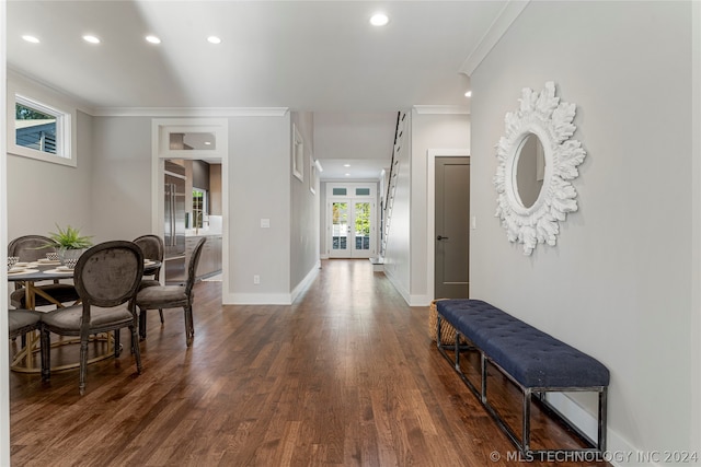 interior space featuring ornamental molding and dark hardwood / wood-style floors