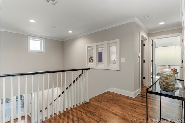 hall featuring dark hardwood / wood-style floors and ornamental molding