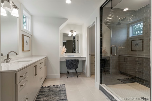 bathroom featuring vanity, walk in shower, and tile patterned flooring