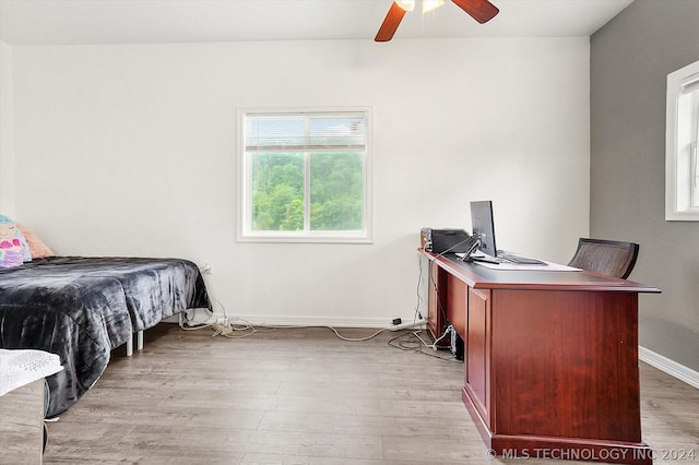 bedroom featuring ceiling fan and light wood-type flooring