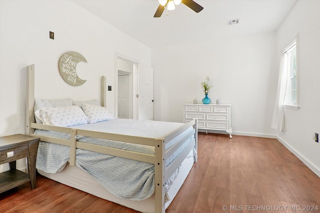 bedroom with ceiling fan and wood-type flooring