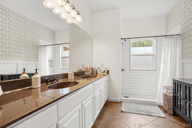 bathroom with vanity, tile patterned flooring, and walk in shower