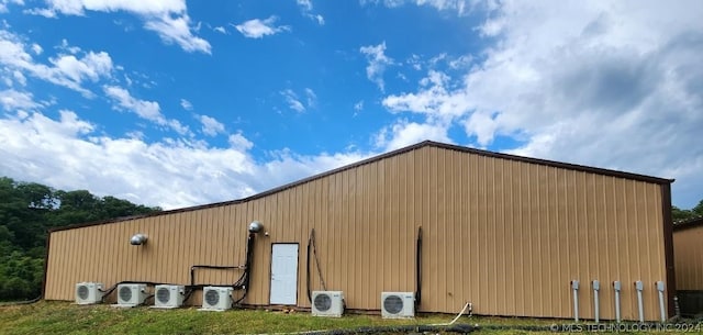 view of outbuilding featuring ac unit