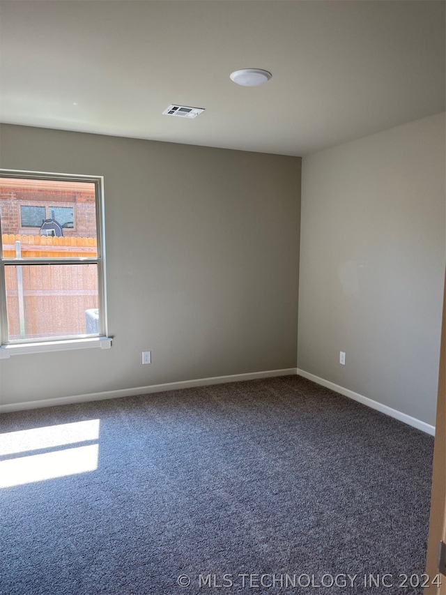 empty room featuring carpet floors