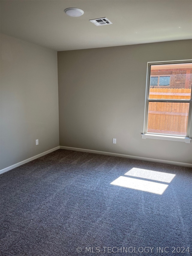 empty room featuring carpet floors