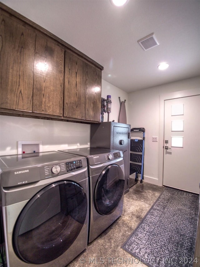 laundry area with recessed lighting, visible vents, baseboards, cabinet space, and washer and clothes dryer