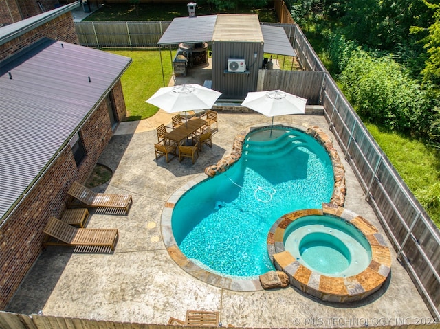 view of swimming pool with outdoor dining area, a yard, a patio, a pool with connected hot tub, and a fenced backyard