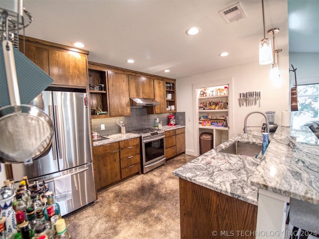 kitchen with visible vents, appliances with stainless steel finishes, under cabinet range hood, open shelves, and a sink