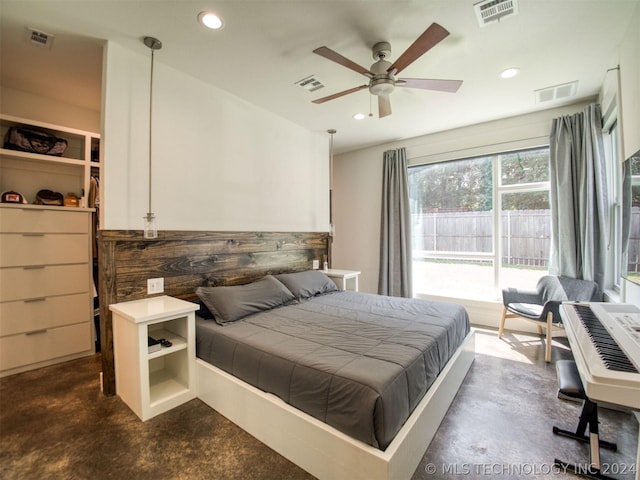 bedroom featuring finished concrete floors, recessed lighting, and visible vents