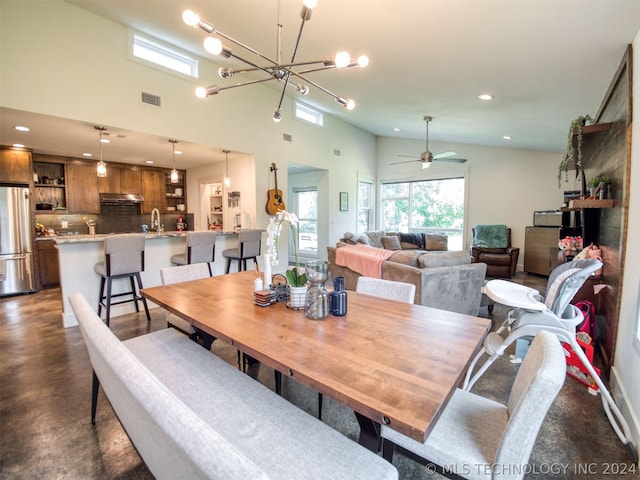 dining area featuring high vaulted ceiling, recessed lighting, visible vents, and plenty of natural light