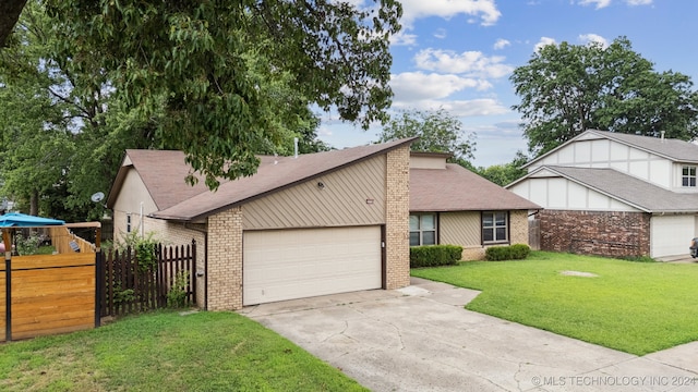 view of front of house featuring a garage and a front lawn