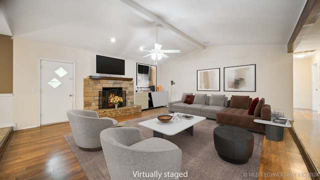 living room with a fireplace, vaulted ceiling with beams, a ceiling fan, and wood finished floors