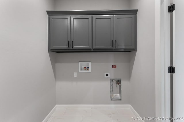 clothes washing area with baseboards, hookup for a washing machine, cabinet space, and hookup for an electric dryer