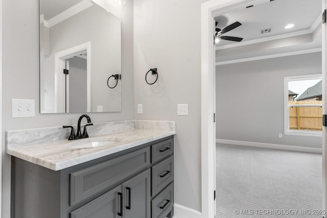 bathroom with ornamental molding, visible vents, ceiling fan, and baseboards