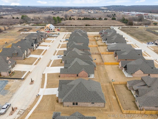 birds eye view of property with a residential view