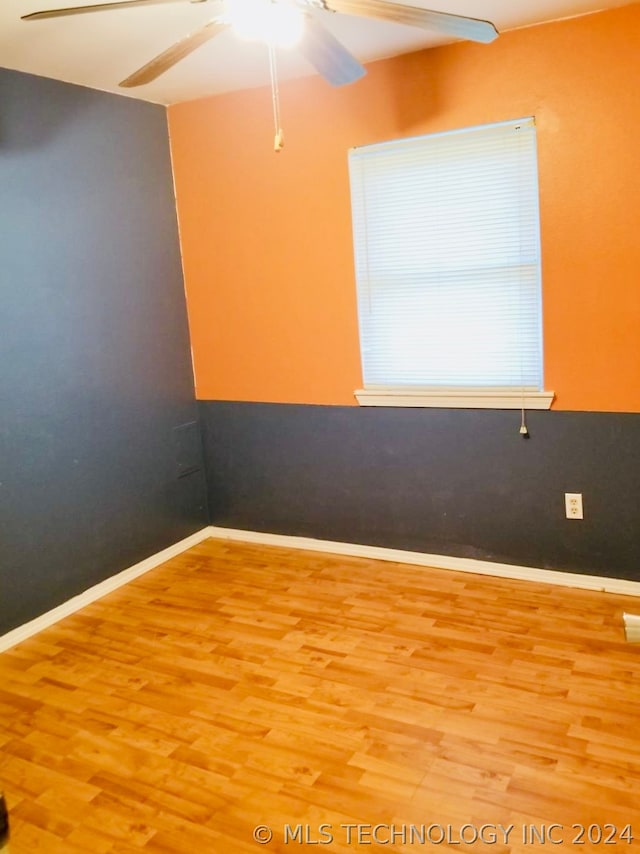 spare room with ceiling fan and light hardwood / wood-style flooring