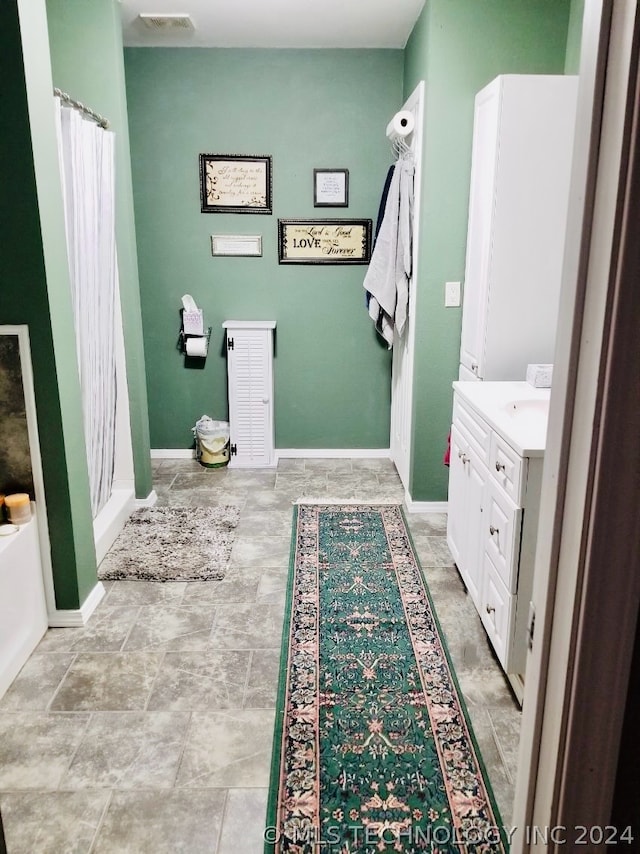 bathroom featuring vanity and tile patterned flooring