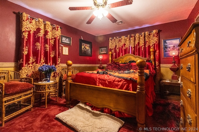 bedroom with dark carpet and ceiling fan