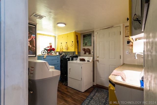 clothes washing area with washer / clothes dryer and hardwood / wood-style floors