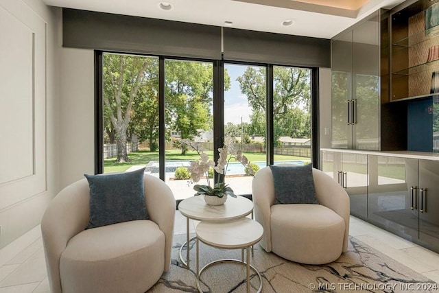 sitting room with light tile patterned floors