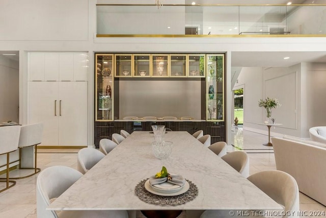 dining area featuring light tile patterned floors