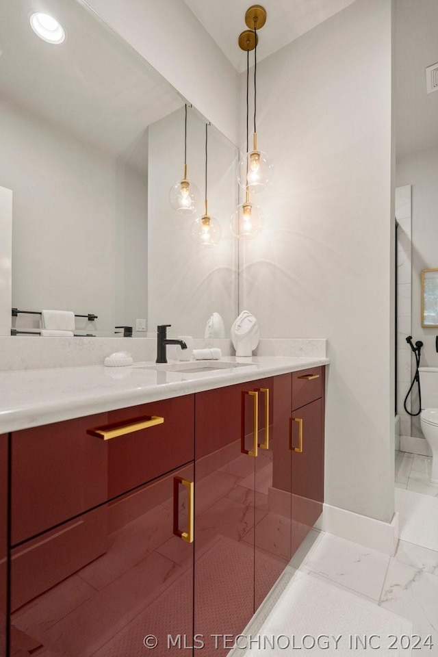 bathroom with vanity, toilet, and an enclosed shower