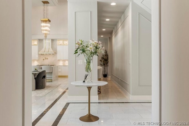 hallway featuring light tile patterned floors