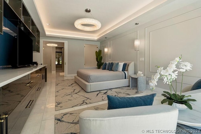 bedroom featuring a raised ceiling