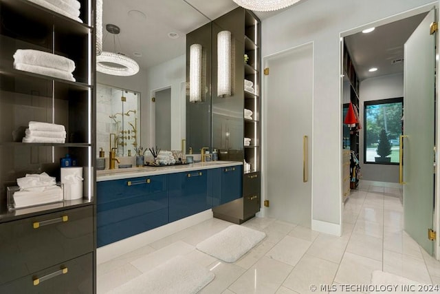 bathroom with vanity, walk in shower, and tile patterned floors