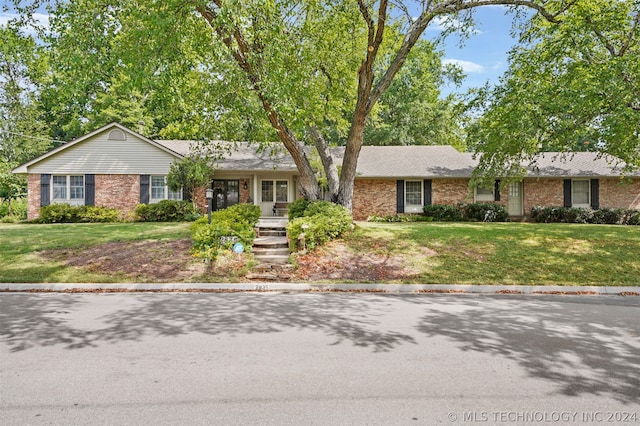 ranch-style house with a front yard