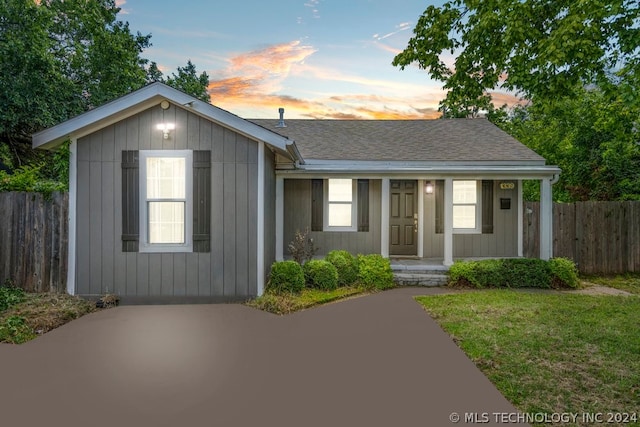 view of front of property with a yard