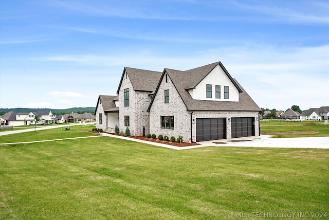 view of front of property featuring a front lawn and a garage