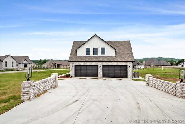 view of home's exterior featuring a yard and a garage