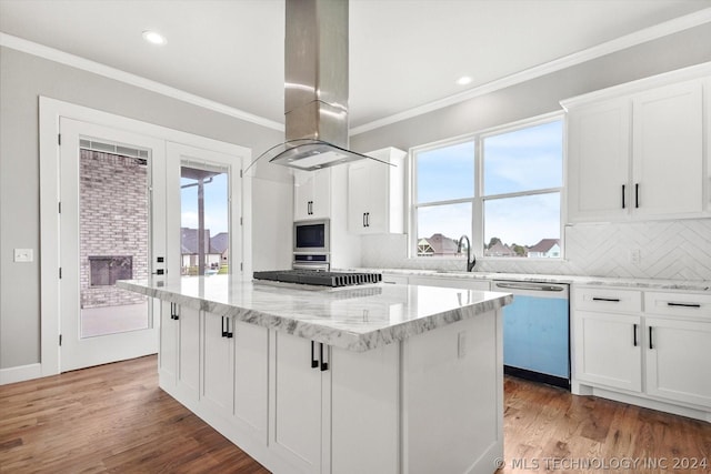 kitchen featuring a center island, white cabinetry, island exhaust hood, and stainless steel dishwasher