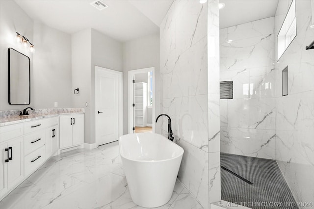 bathroom with vanity and a bathing tub