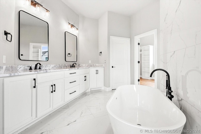 bathroom with vanity and a bathing tub